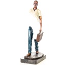 Farbige Bronzefigur Mann mit Koffer Modern